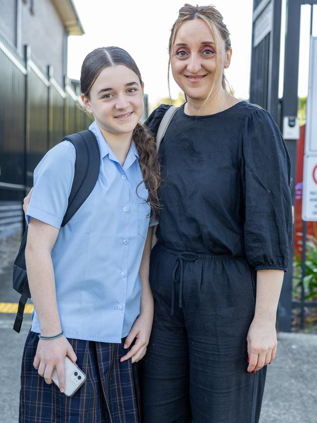 Mum Julie Stefanakis drops her daughter Aleksia Stefanakis at her first day of Year 7 at Georges River College in Hurstville. Picture: Thomas Lisson