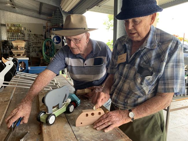 Bill Seymour, 91, and Kevin Windsor, 88, have created more than 1000 toys for Mackay foster children at the Beaconsfield Road Men's Shed. Picture: Heidi Petith