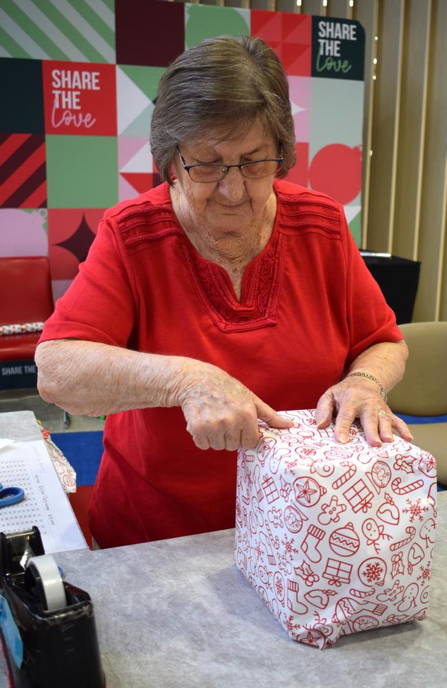 Di Wode wrapping a Christmas present. Picture: Aden Stokes