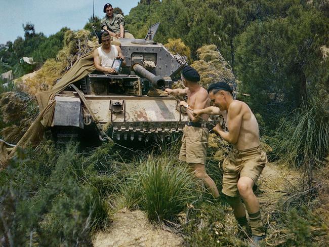 A crew from the 16th/5th Lancers, 6th Armoured Division, clean the gun barrel of their Crusader tank at El Aroussa in Tunisia, May 1943. Picture: Imperial War Museum