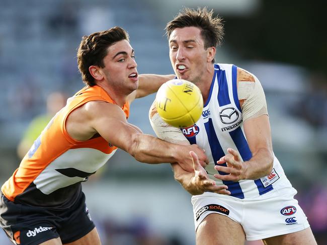 CANBERRA, AUSTRALIA - MARCH 10:  Sam Wright of the Kangaroos is challenged by Tim Taranto of the Giants during the JLT Community Series AFL match between the Greater Western Sydney Giants and the North Melbourne Kangaroos at UNSW Canberra Oval on March 10, 2017 in Canberra, Australia.  (Photo by Matt King/Getty Images)