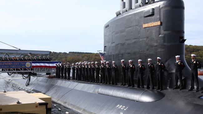 Crew members stand topside during the commissioning of the USS Illinois. Picture: Michelle McLoughlin