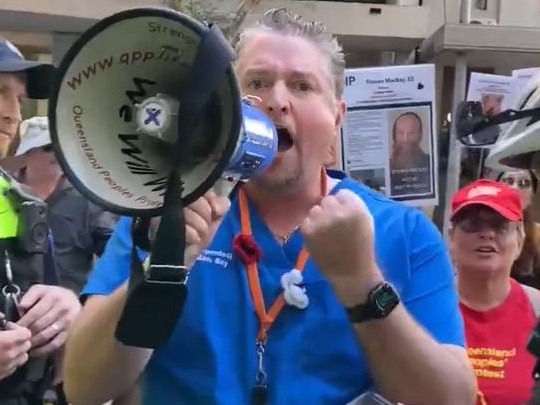 William Bay during a protest outside of AHPRA's Brisbane office, where he was subsequently arrested by police and charged with contravening a direction. Picture: Supplied / Twitter