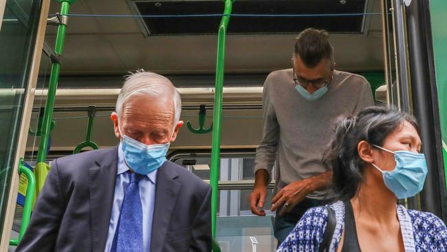 Passengers wearing masks disembark a Melbourne tram on Thursday. Picture: Getty Images