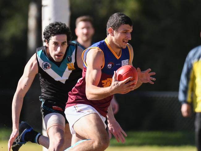 Daniel Caruso looks to evade a tackler for South Morang last season. Picture: Nathan McNeill. 