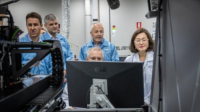 The PM started his election campaign on his birthday with Gladys Liu for a tour of Extel Technologies. Picture: Jason Edwards