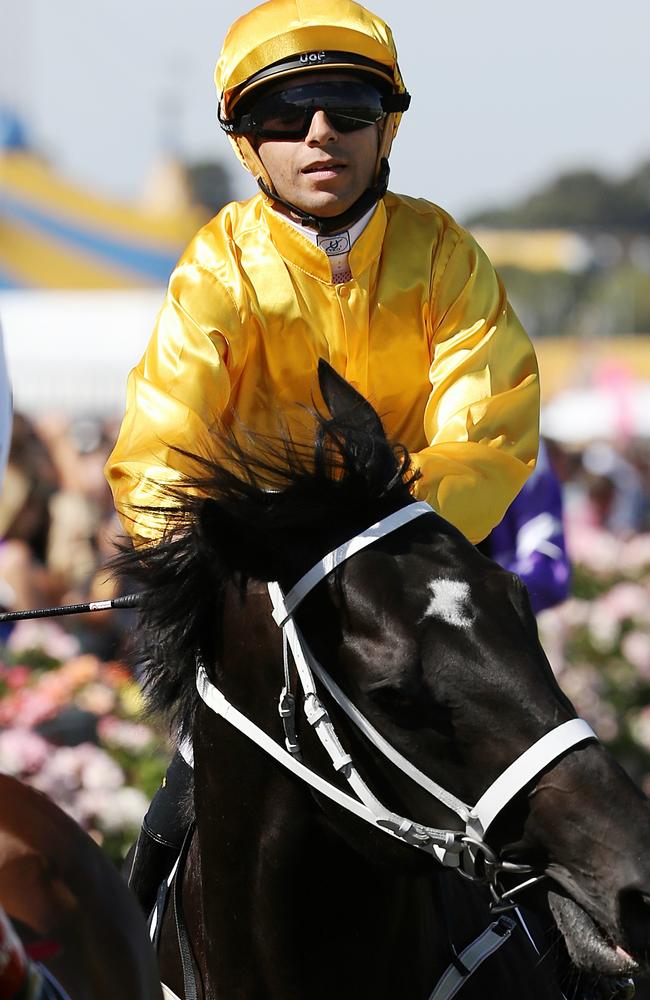 Joao Moreira after winning the 2015 Newmarket Handicap at Flemington aboard Brazen Beau. Picture: George Salpigtidis