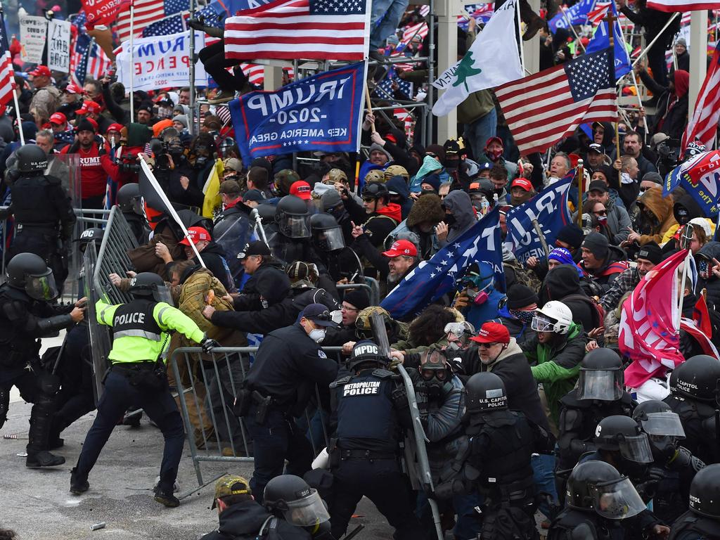 Trump supporters clash with police and security forces as they push barricades to storm the US Capitol in Washington D.C. Picture: Roberto Schmidt/AFP