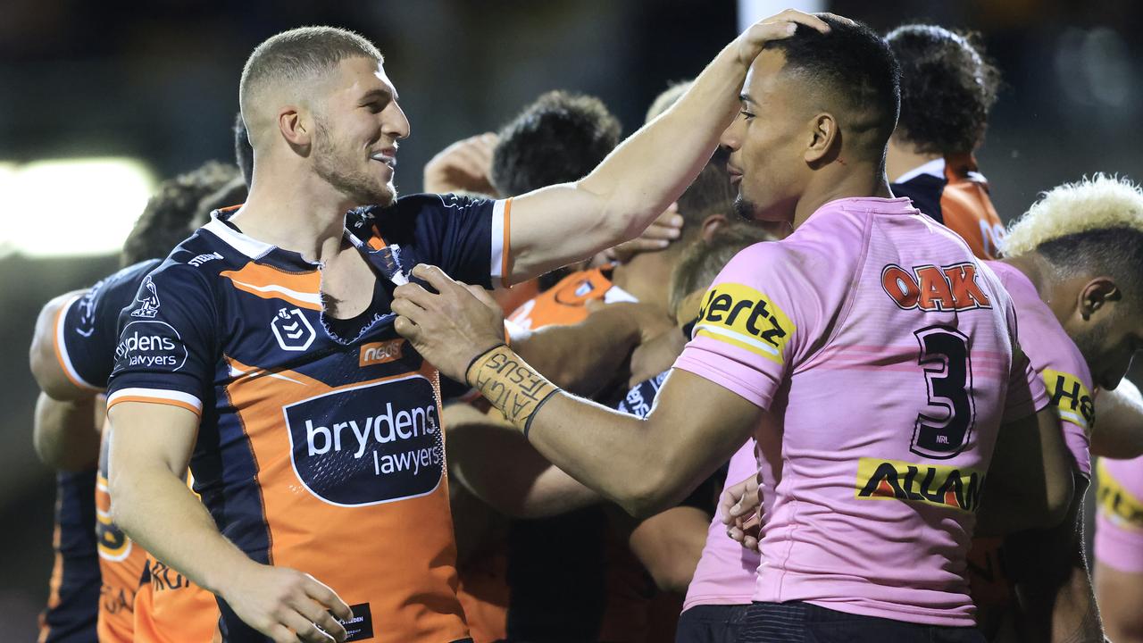 SYDNEY, AUSTRALIA - JUNE 04: Adam Doueihi of the Tigers taunts Stephen Crichton of the Panthers after a Tigers try during the round 13 NRL match between the Wests Tigers and the Penrith Panthers at Leichhardt Oval, on June 04, 2021, in Sydney, Australia. (Photo by Mark Evans/Getty Images)