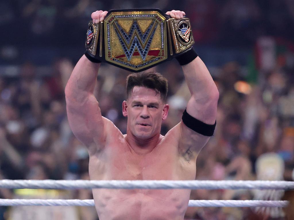 Cena celebrates after defeating Cody Rhodes for the Undisputed WWE Championship. (Photo by Ethan Miller/Getty Images)