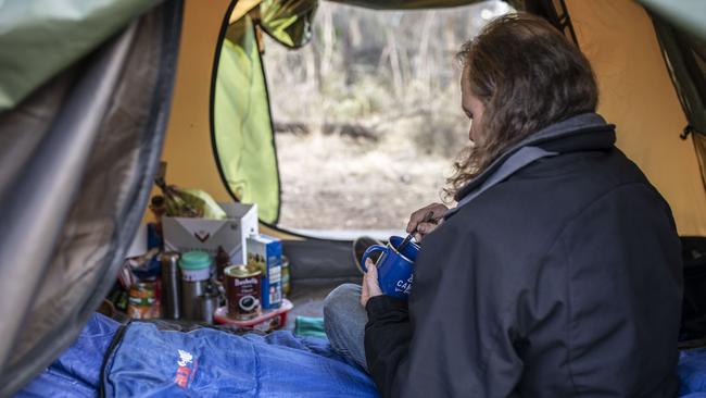 Scott in his tent at his camp in suburban bushland. Picture: EDDIE SAFARIK