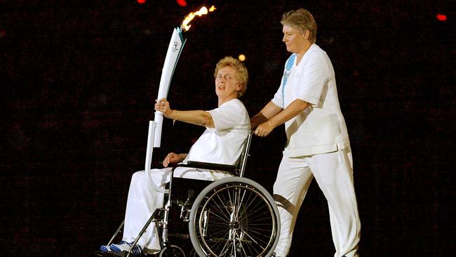 Olympic running legends Betty Cuthbert (L) and Reelene Boyle at the opening ceremony. Picture: Patrick Hertzog/AFP