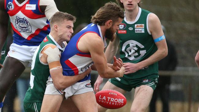 Jesse Tardio is tackled by Jackson Hasler. Picture: Hamish Blair