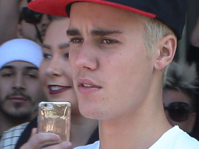 Justin Bieber leaves Nandos Chicken in South Melbourne. Sunday, Sept 27. 2015. Picture: David Crosling