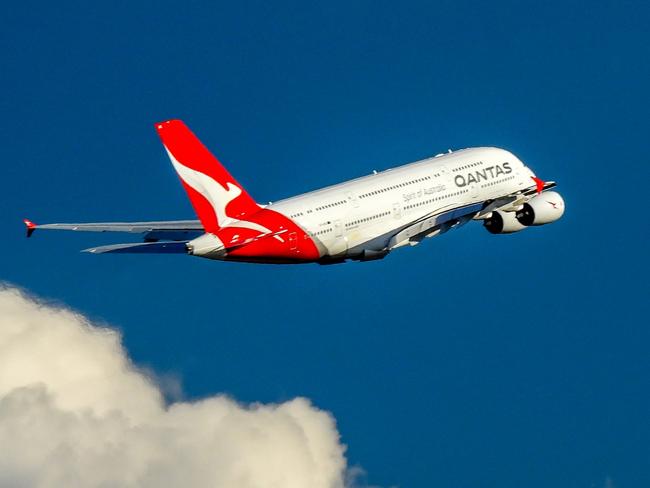 A Qantas Airbus A380-842, registration VH-OQK, has taken off to the west from Sydney Kingsford-Smith Airport and climbing above the clouds.  She is heading to Singapore as flight QF1.  This image was taken from Nigel Love Bridge off Airport Drive, Mascot on a sunny and windy afternoon on 8 April 2023.Escape 16 June 2024Why I TravelPhoto - iStock