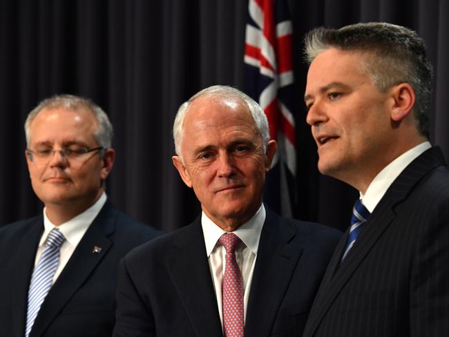 Treasurer Scott Morrison, Prime Minister Malcolm Turnbull and Finance Minister Mathias Cormann have talked up the need for wider cuts to the corporate tax rate. Picture: AAP Image/Mick Tsikas