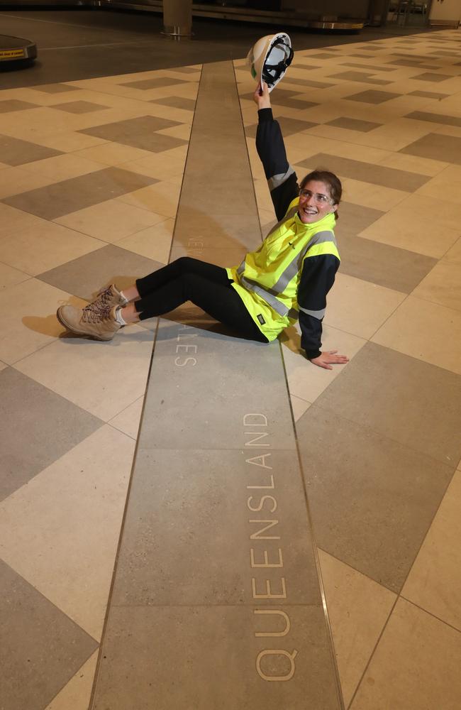 Team Administrator Kiralee Castellano at the line marking the border inside the baggage reclaim area. Picture: Glenn Hampson.