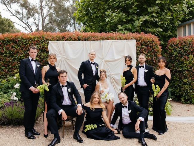 Woody Whitelaw and Mim Gibbs with their wedding party. Picture: Mimo Weddings