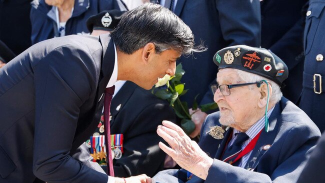 Rishi Sunak meets with a British D-Day veteran during the commemorative ceremony marking the 80th anniversary of D-Day.