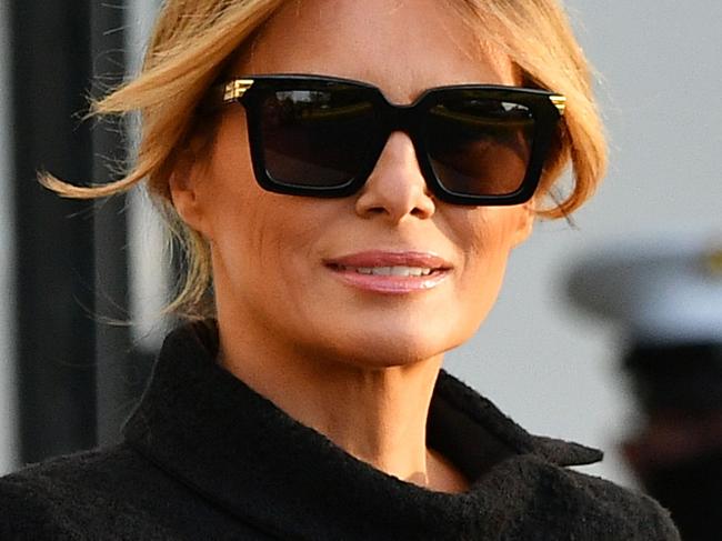 US President Donald Trump and First Lady Melania Trump make their way to board Marine One as they depart the White House in Washington, DC, on January 20, 2021. - President Trump travels to his Mar-a-Lago golf club residence in Palm Beach, Florida, and will not attend the inauguration for President-elect Joe Biden. (Photo by MANDEL NGAN / AFP)