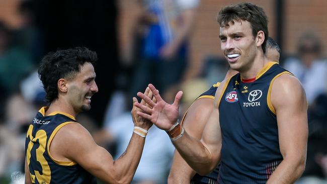 ADELAIDE, AUSTRALIA - MARCH 02: Izak Rankine of the Crows   celebrates a goal  with  Riley Thilthorpe of the Crows  during the 2024 AFL Community Series match between Adelaide Crows and West Coast Eagles at Hisense Stadium on March 02, 2024 in Adelaide, Australia. (Photo by Mark Brake/Getty Images)