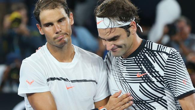 Sportsmanship at its best ... Raphael Nadal congratulates Australian Open winner Roger Federer after a classic final. Picture: Michael Dodge (Getty Images)