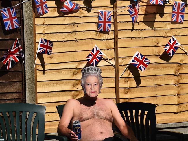 It was a nice day to put on a Queen mask and take your shirt off and celebrate in the sun. Picture: AFP