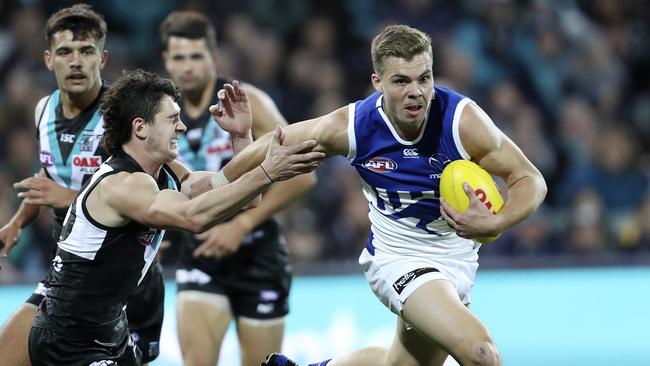 AFL — Port Adelaide v North Melbourne a Adelaide Oval. Cameron Zurhaar pushes aside Darcy Byrne-Jones. Picture SARAH REED