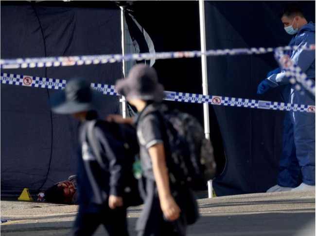 This photo of schoolkids looking on as Stemler’s dead body lay on the streets shocked the community at the time. Picture: NCA NewsWire