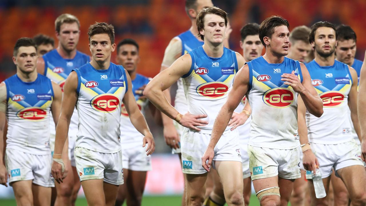 Gold Coast players look dejected after another loss in 2018.