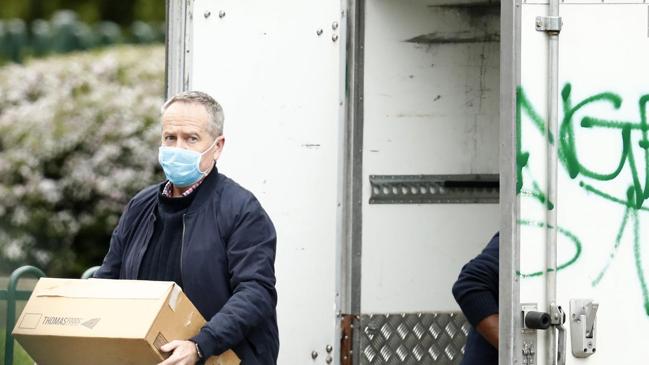 Bill Shorten delivers food to the Flemington Towers Government Housing complex on Monday. Picture: Darrian Traynor/Getty Images