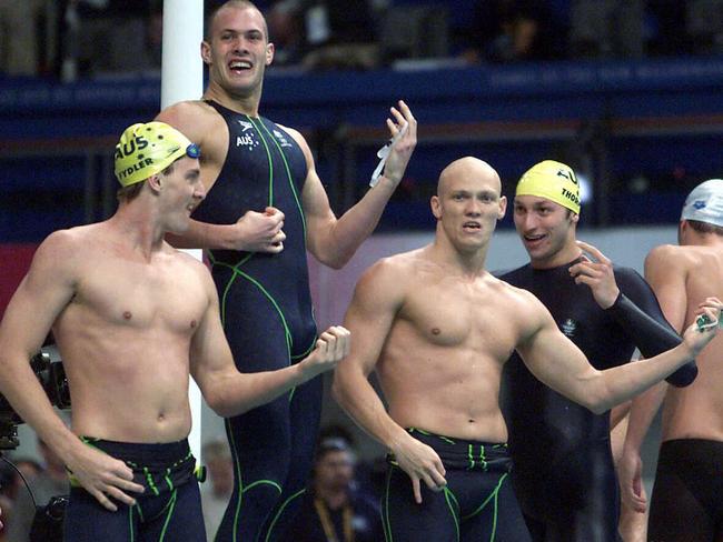 Chris Fydler, Ashley Callus, Michael Klim and Ian Thorpe play air guitar after victory in the 4x100 relay final.