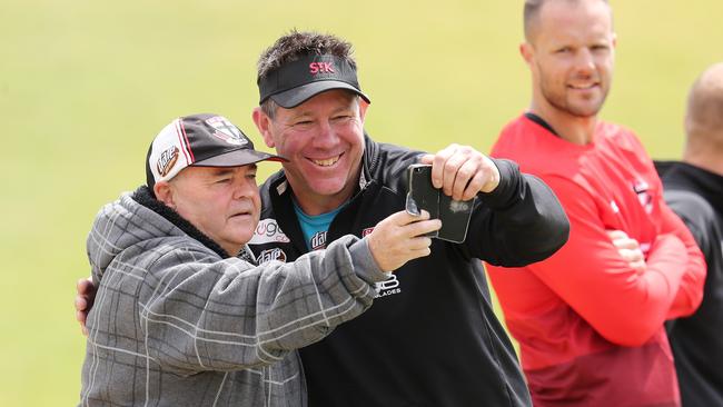 Coach Brett Ratten poses for a selfie with a Saints fan. Picture: Michael Klein