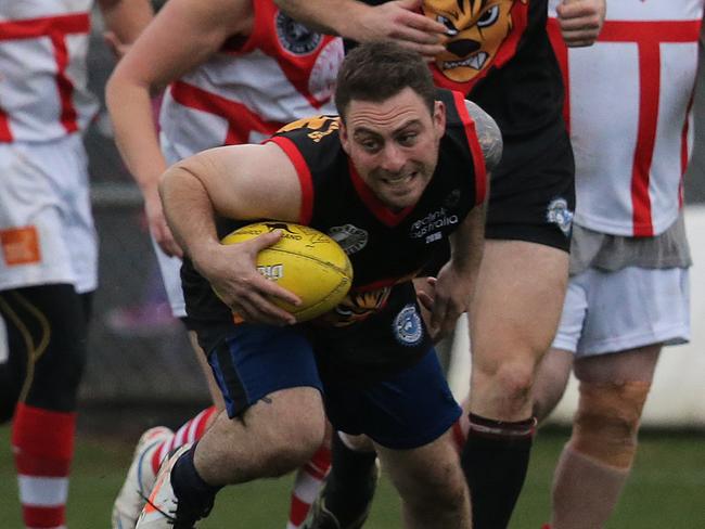 Musician Mischa Calcagno breaks free from the pack last year’s Reclink Community Cup. Picture: LUKE BOWDEN