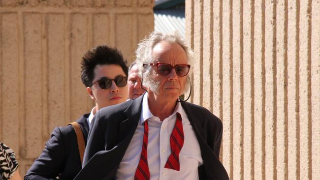 Lawyer Tom Grace, representing the Department of Logistics and Infrastructure, heads into Alice Springs Local Court. Picture: Gera Kazakov