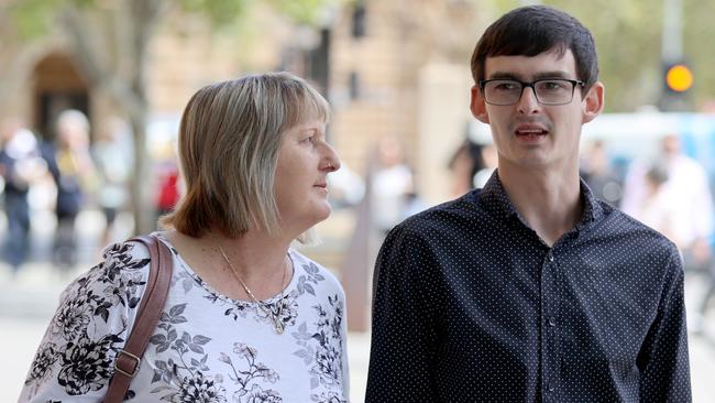 The victim of the alleged assault, Matthew Odgers, leaves court with his mother on Monday. Picture: Kelly Barnes