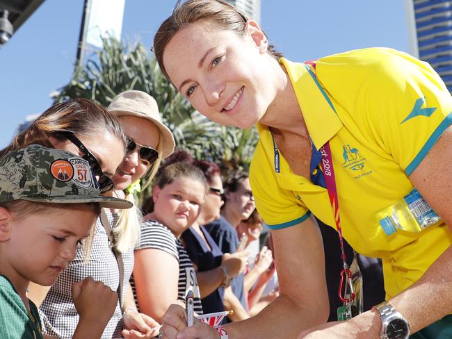 Swimmer Cate Campbell signs autograph for waiting fans as she arrives with the Australian Commonwealth Games team for a public event on Surfers Paradise, Gold Coast, Monday, April 16, 2018. (AAP Image/Regi Varghese) NO ARCHIVING