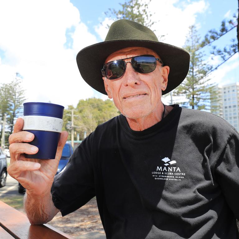 Rein Kruusmaa enjoys a morning coffee at Burleigh Beach Photo: Scott Powick Newscorp