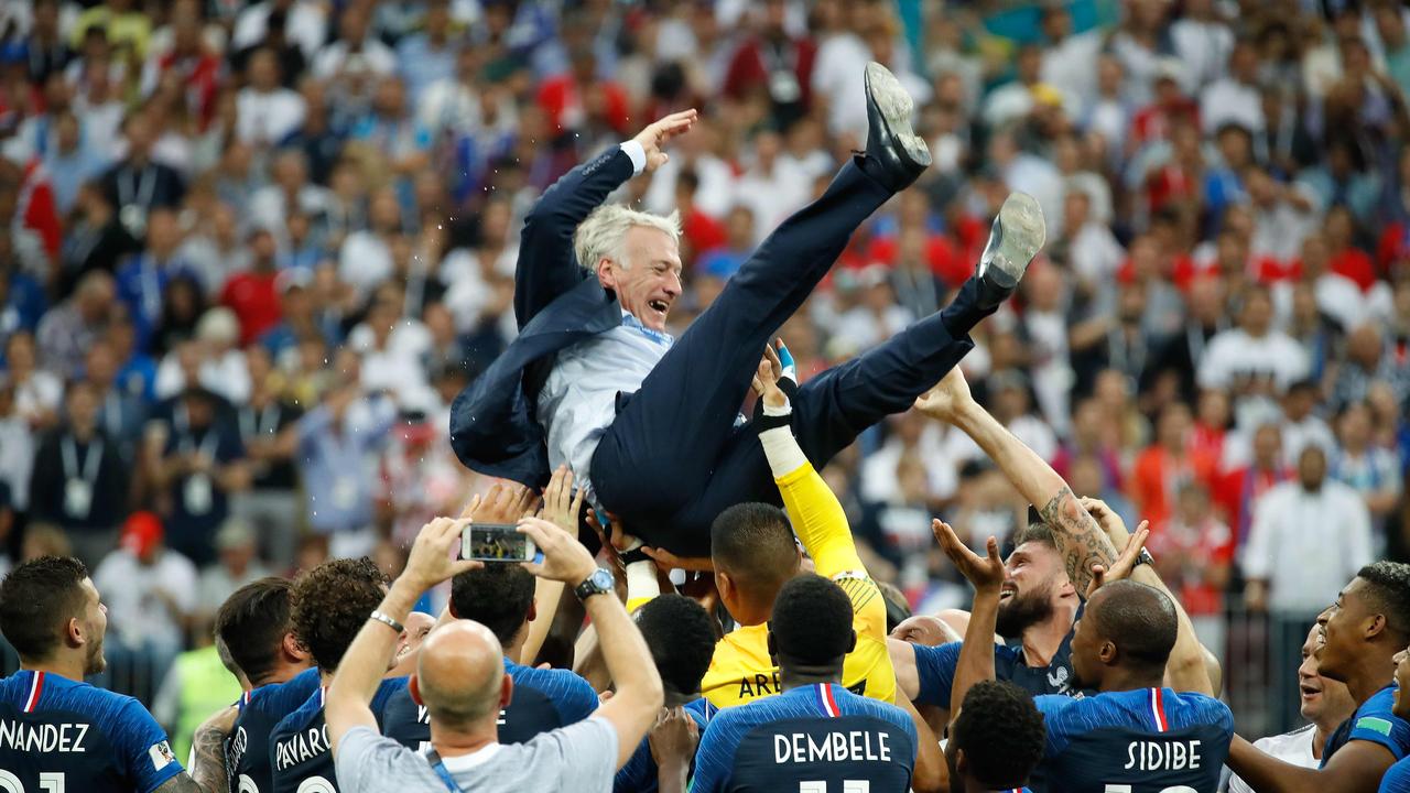 Didier Deschamps is thrown in the air after France won the 2018 World Cup