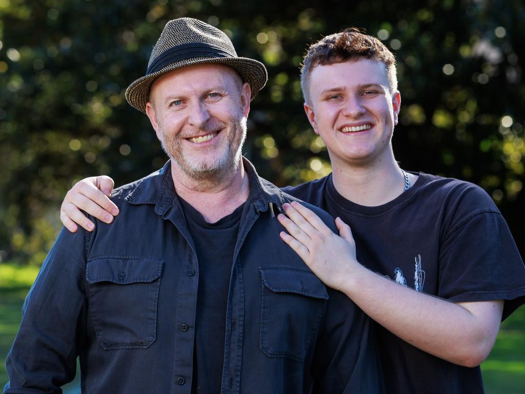 Jayden Cummins, pictured with his son Henry in 2021, had a heart transplant after a serious flu left him close to heart failure. Picture: Justin Lloyd