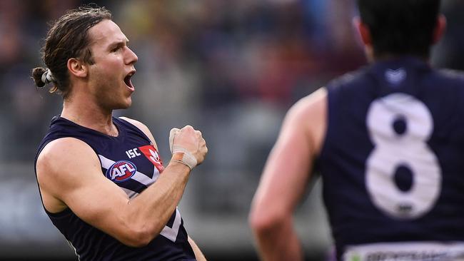 Hard-running wingman Ed Langdon has been traded from the Dockers to the Demons.