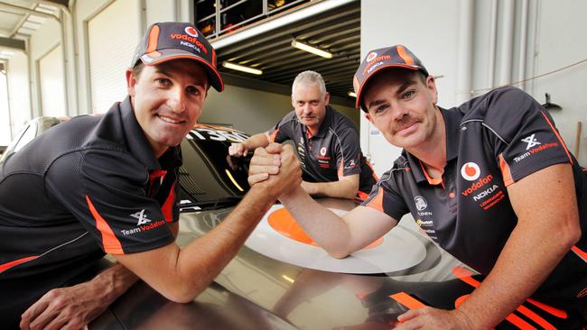 Drivers Jamie Whincup and Craig Lowndes with former Vodafone team manager Adrian Burgess. Picture: Brendan Radke