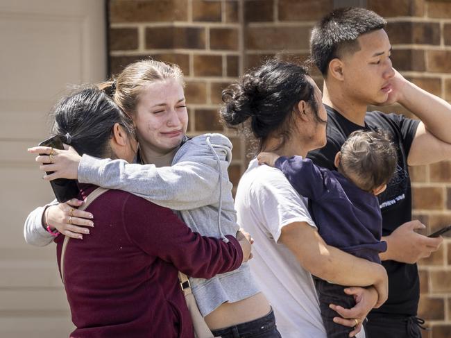 Friends and family grieve. Picture: Jake Nowakowski