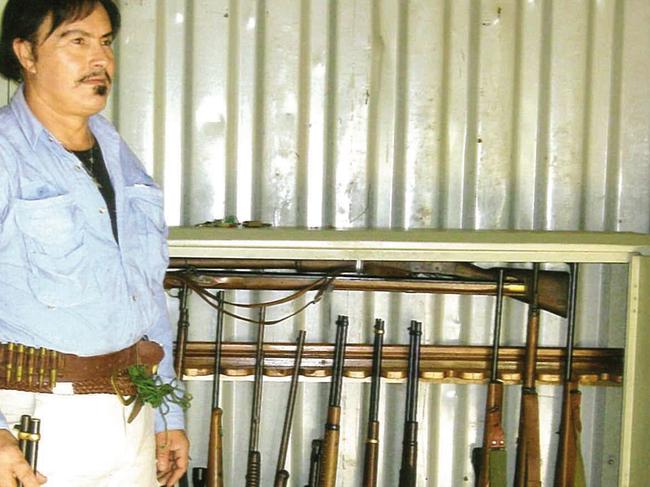 Charles Bisucci, pictured here in about 2010 in a shipping container with 15 guns previously registered in his name, was able to access firearms thanks to alleged “holding arrangements” with his friends after he was banned from holding a gun licence. Picture: Supplied