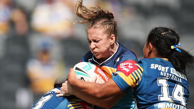 Karina Brown of the Titans is tackled during the round three NRLW match between the Parramatta Eels and the Gold Coast Titans at CommBank Stadium, on March 13, 2022, in Sydney, Australia. (Photo by Matt King/Getty Images)