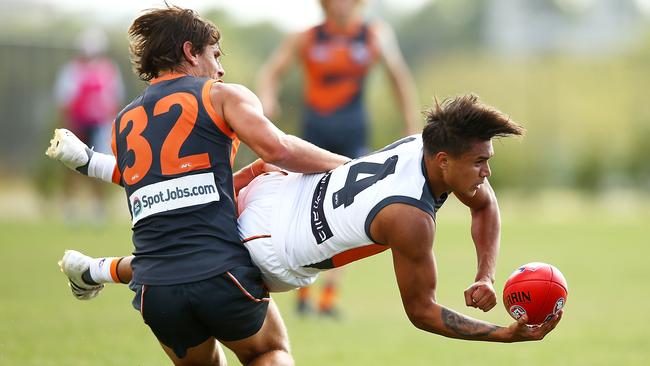 Jarrod Pickett is tackled by Ryan Griffen in a GWS Giants intra-club match.