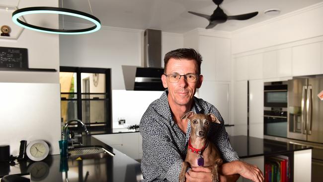 Wayne McDonald with Bella is happy to finally be home after the 2019 floods. Picture: Shae Beplate.