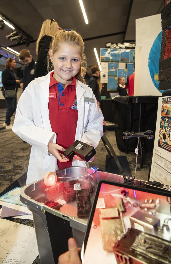 Vale View State School student Sophia Scheid with the teams life scanners for Mars display as part of Kids in Space Queensland finals and showcase at Edmund Rice Cultural Centre St Mary's College, Friday, June 7, 2024. Picture: Kevin Farmer