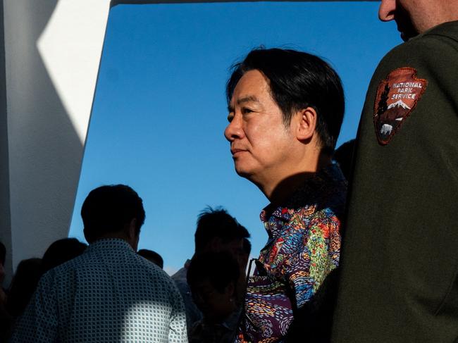 Taiwan President Lai Ching-te (2nd R) visits the USS Arizona Memorial at Pearl Harbor in Honolulu, Hawaii on November 30, 2024. Taiwan President Lai Ching-te arrived November 30 in the United States for the start of a week-long tour in the Pacific that he said would usher in a new era of democracy, but has sparked fury in Beijing. (Photo by Akio Wang / AFP)