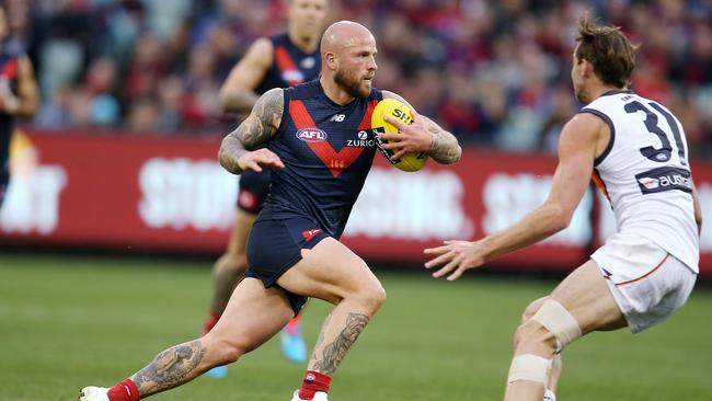 Melbourne’s Nathan Jones tries to evade GWS’ Jeremy Finlayson. Picture: Michael Klein